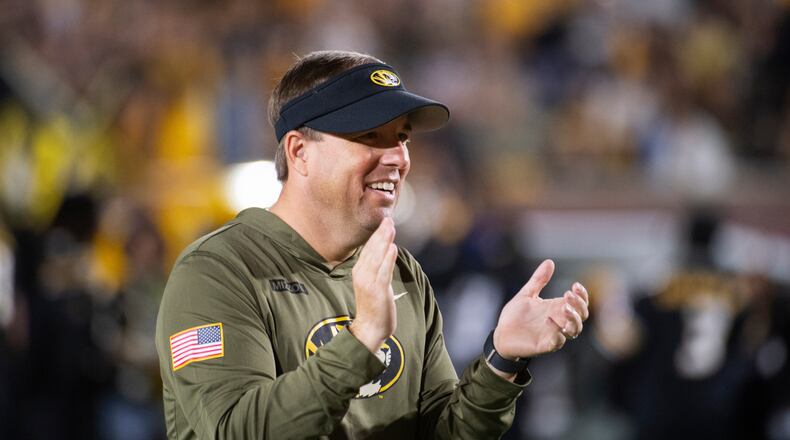 Missouri head coach Eli Drinkwitz claps during the first half of an NCAA college football game against Mississippi State, Saturday, Nov. 15, 2025, in Columbia, Mo. (AP Photo/L.G. Patterson)