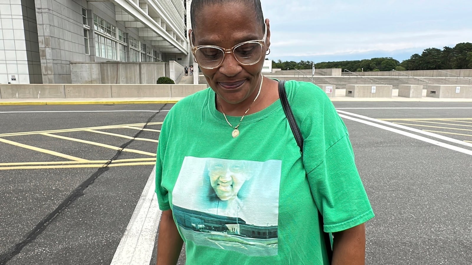 Elizabeth Alvarado stands outside federal court in Central Islip, N.Y., on Wednesday, July 2, 2025, wearing a shirt bearing an image of her daughter, Nisa Mickens, who was slain by MS-13 gang members in 2016. (AP Photo/Philip Marcelo)
