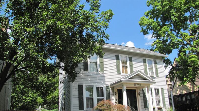 Built in 1900, this 3-bedroom home offers large rooms and an open staircase. With about 1.680 sq. ft. of living space, the home has a full, unfinished basement, rear deck and fenced yard. CONTRIBUTED PHOTO