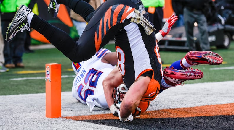 Cincinnati Bengals tight end Tyler Eifert gets inverted as he misses a pass defended by Buffalo Bills linebacker Preston Brown during their 16-12 loss to the Buffalo Bills in the 2016 season at Paul Brown Stadium in Cincinnati. NICK GRAHAM/STAFF