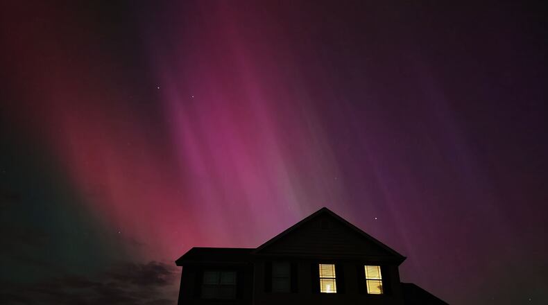 A large geomagnetic storm caused the Northern Lights to be visible in the Miami Valley. Photos taken in Madison Twp., Butler County | NICK GRAHAM/STAFF