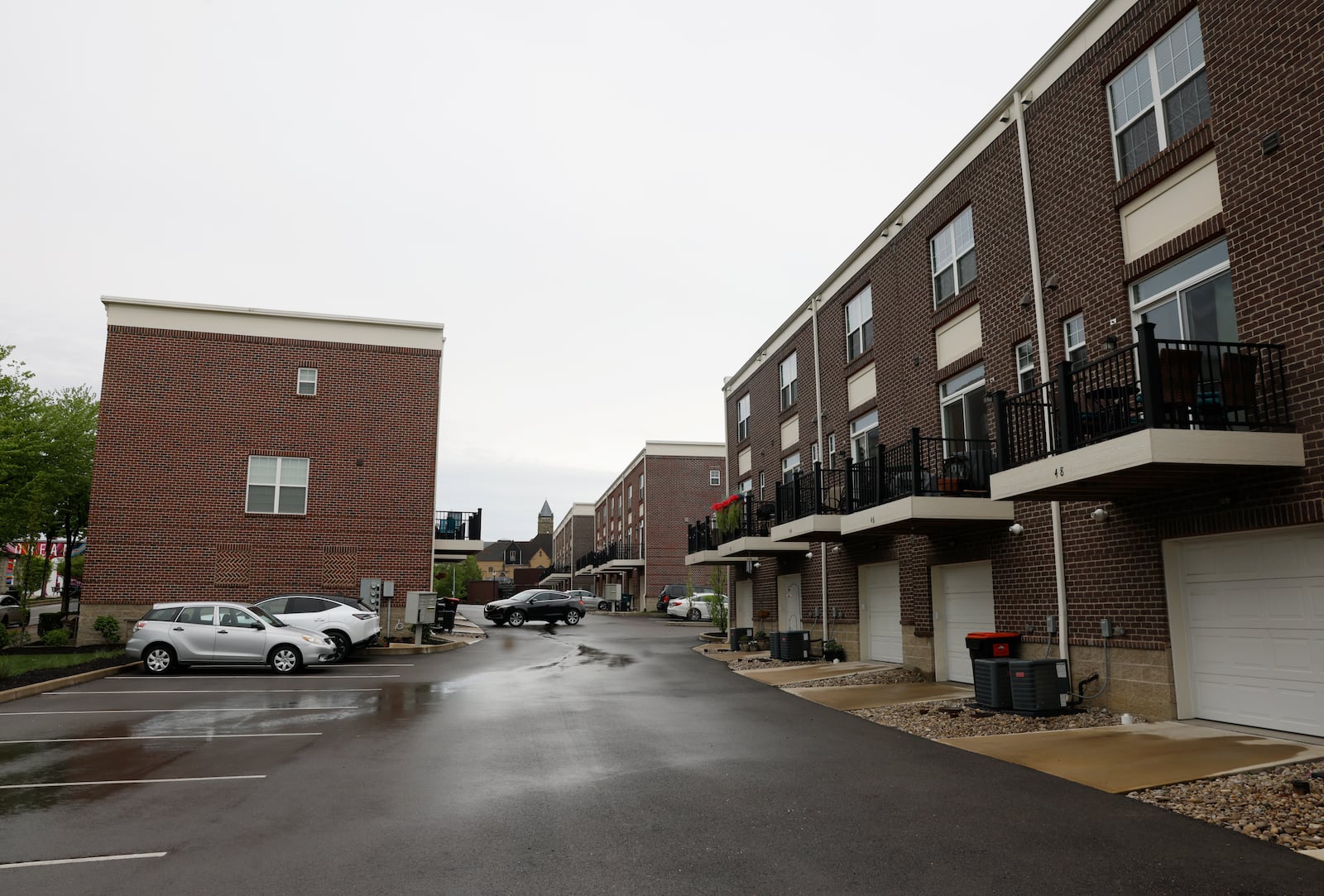 A driver prepares to exit the complex on Tuesday, April 29, 2025, at Center Street Townhomes. JOSEPH COOKE/STAFF

