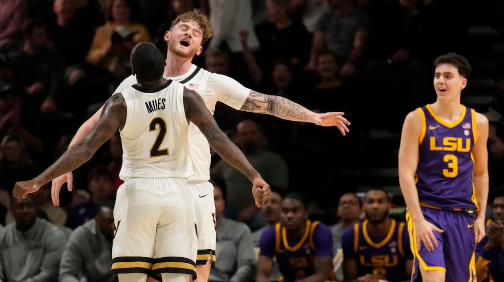 Vanderbilt guard Duke Miles (2) and forward Tyler Nickel, right, celebrate, during the first half of an NCAA college basketball game against LSU, Saturday, Jan. 10, 2026, in Nashville, Tenn. (AP Photo/George Walker IV)
