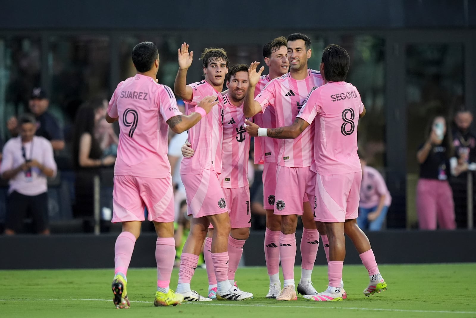 FILE - Teammates celebrate with Inter Miami forward Lionel Messi (10), center, after he scored his side's second goal against Columbus Crew during the first half of an MLS soccer match, Saturday, May 31, 2025, in Fort Lauderdale, Fla. (AP Photo/Rebecca Blackwell, File)