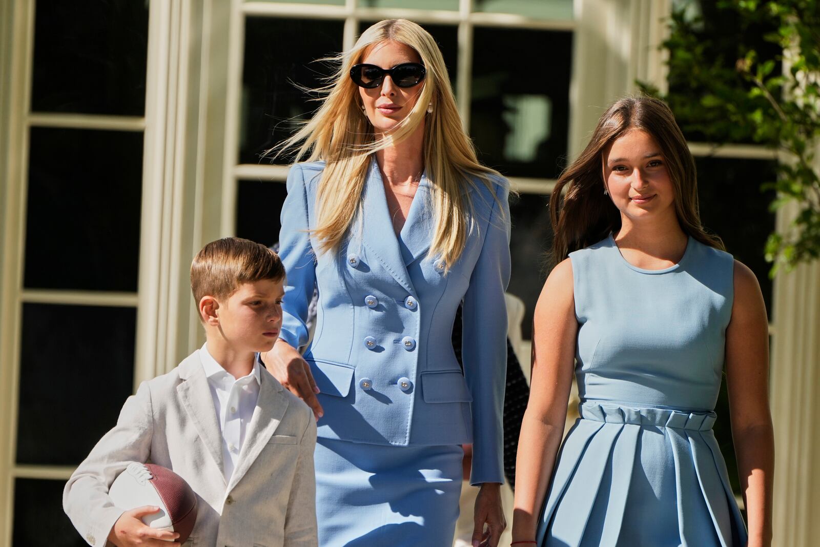 Ivanka Trump walks with two of her children before President Donald Trump welcomes the Super Bowl champion Philadelphia Eagles NFL football team to the South Lawn of the White House, Monday, April 28, 2025, in Washington. (AP Photo/Mark Schiefelbein)