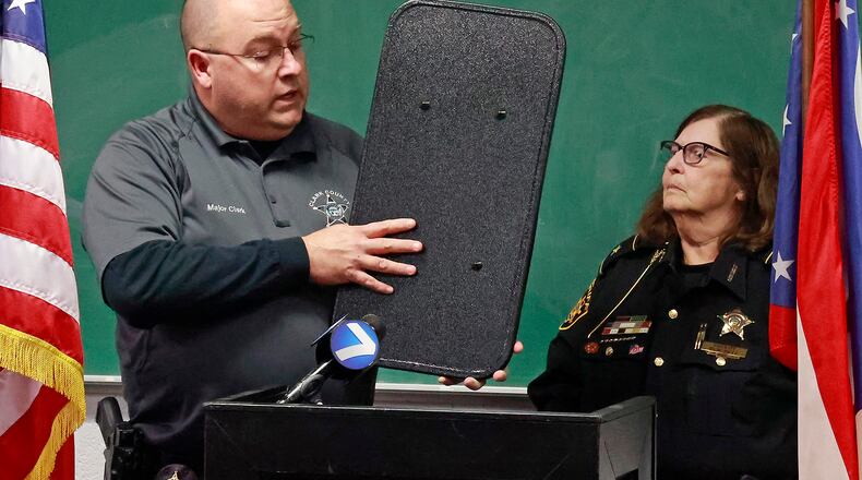 Clark County Sheriff Deb Burchett and former Major Chris Clark in January talked about the new ballistic shields supplied to every member of the department. Clark has declared his intent to run for sheriff in 2024 against Burchett.  BILL LACKEY/STAFF