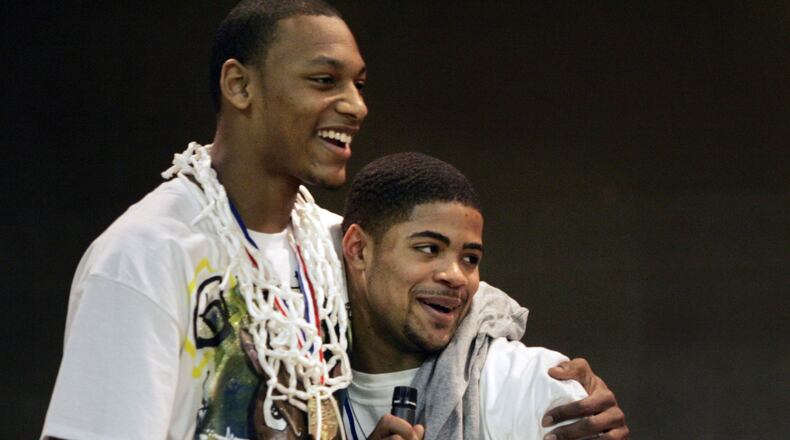 Jefferson High School basketball players Adreian Payne, left, and Cody Latimer celebrate in 2010 after bringing home the Division lV state title. JIM NOELKER / STAFF