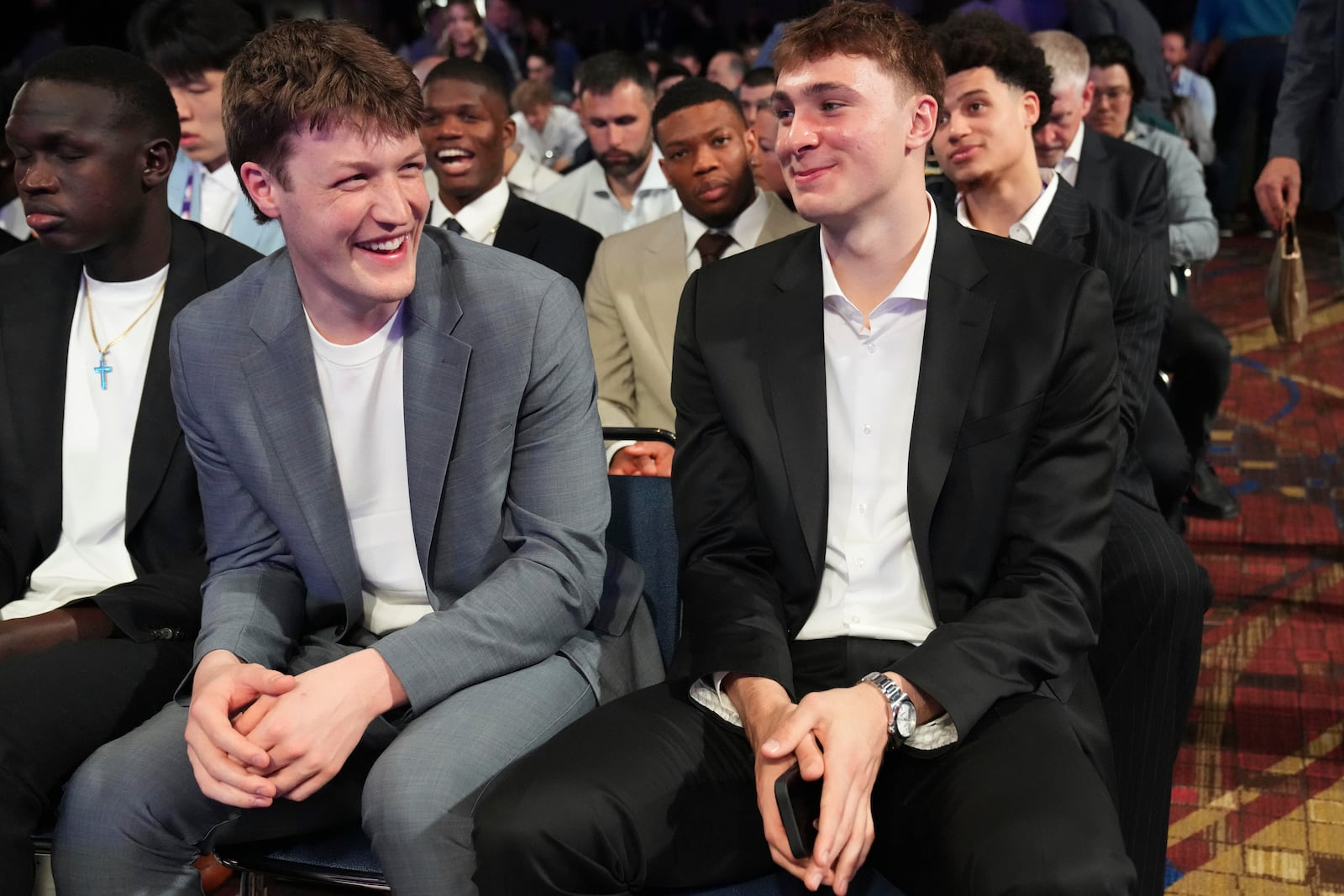 Duke's Kon Knueppel, left, and Cooper Flagg, right, smile at the NBA basketball draft lottery in Chicago, Monday, May 12, 2025. (AP Photo/Nam Y. Huh)