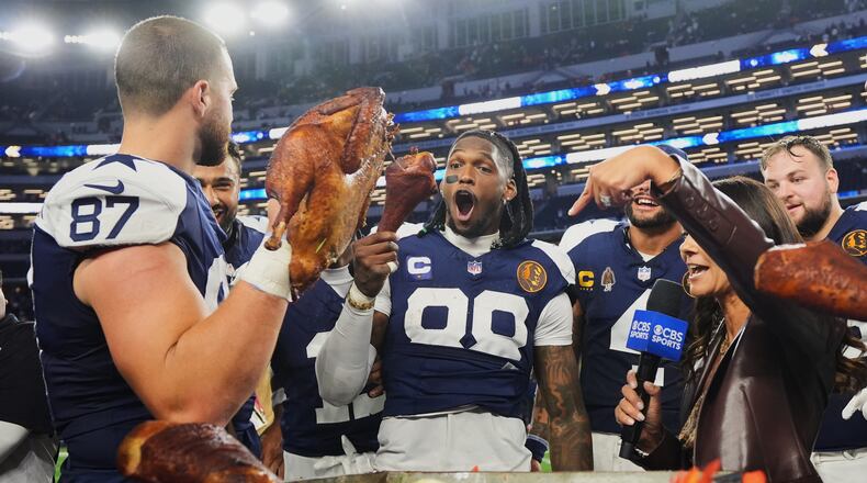 Dallas Cowboys wide receiver CeeDee Lamb (88) and tight end Jake Ferguson (87) celebrate following an NFL football game against the Kansas City Chiefs Thursday, Nov. 27, 2025, in Arlington, Texas. (AP Photo/LM Otero)