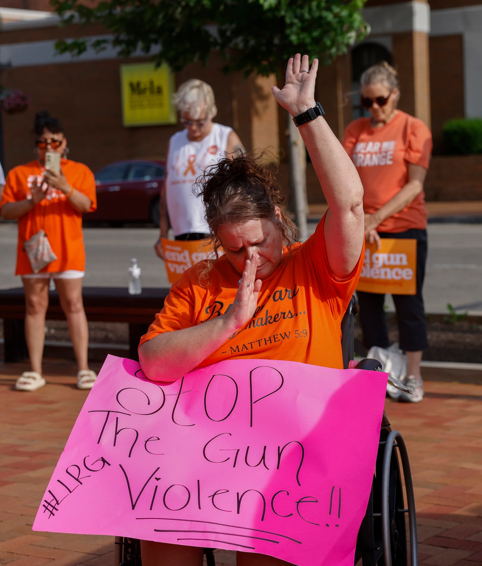 Angela Greene See reacts as a prayer is given during a rally against gun violence on Wednesday, June 18, 2025, outside Springfield City Hall. Her son, Randy Graham Jr., was killed from gun violence on May 14. JOSEPH COOKE/STAFF
