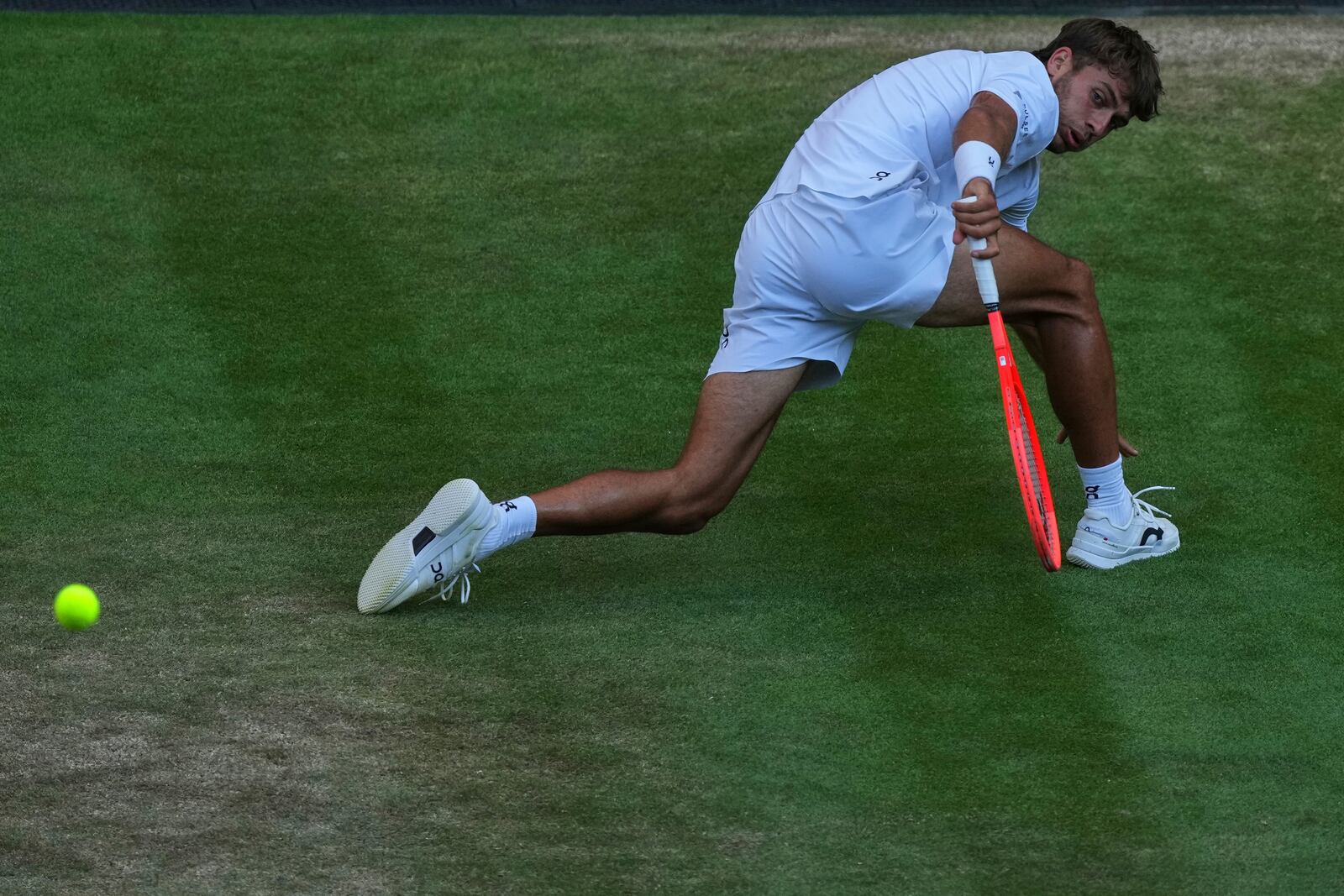 Italy's Flavio Cobolli returns to Serbia's Novak Djokovic during a quarterfinal men's singles match at the Wimbledon Tennis Championships in London, Wednesday, July 9, 2025. (AP Photo/Joanna Chan)