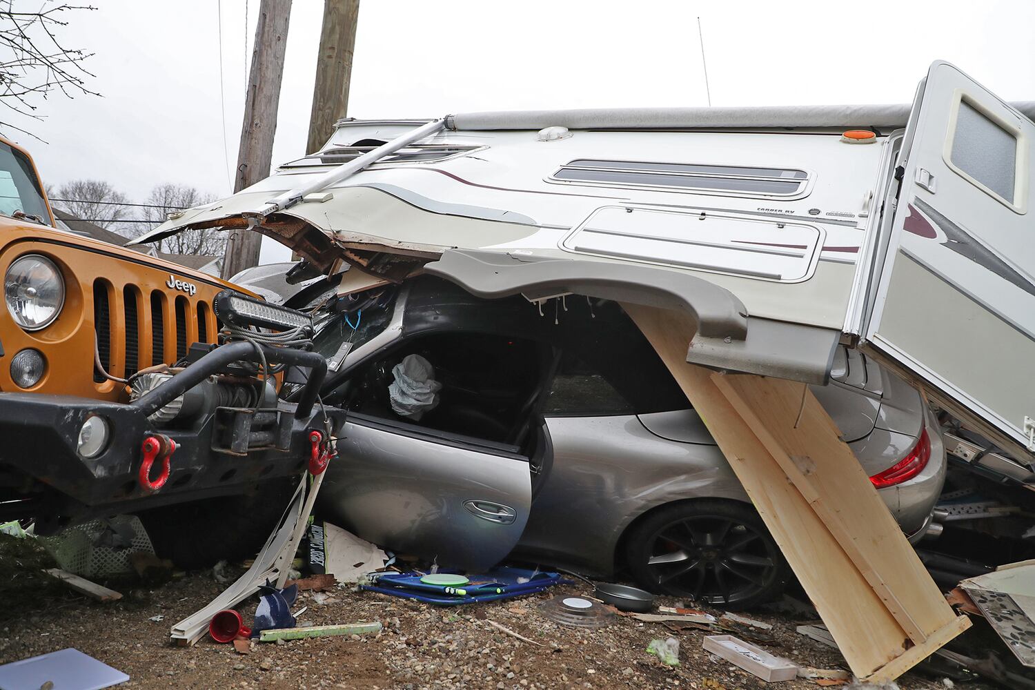 PHOTOS: Porsche Crashes Through Camper