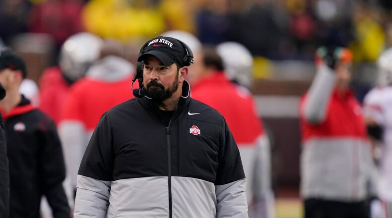 Ohio State head coach Ryan Day walks the sideline during the second half of an NCAA college football game against Michigan, Saturday, Nov. 27, 2021, in Ann Arbor, Mich. (AP Photo/Carlos Osorio)