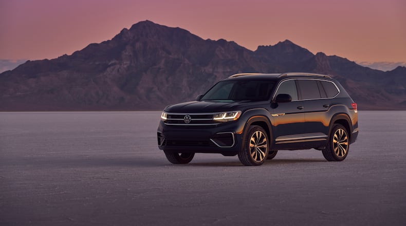 This photo provided by Volkswagen shows the 2021 Atlas, which is quiet and comfortable on the road. It also has the lowest starting price among three-row midsize SUVs. (Courtesy of Volkswagen of America via AP)