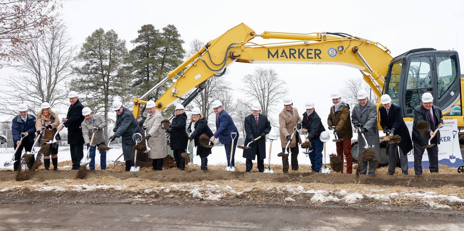 Officials gather to toss mulch at the end of a groundbreaking ceremony to celebrate the expansion of the Springfield Masonic Community on Tuesday, Dec. 16, 2025, in Springfield. Additions include a new assisted living building and modern healthcare center. JOSEPH COOKE/STAFF