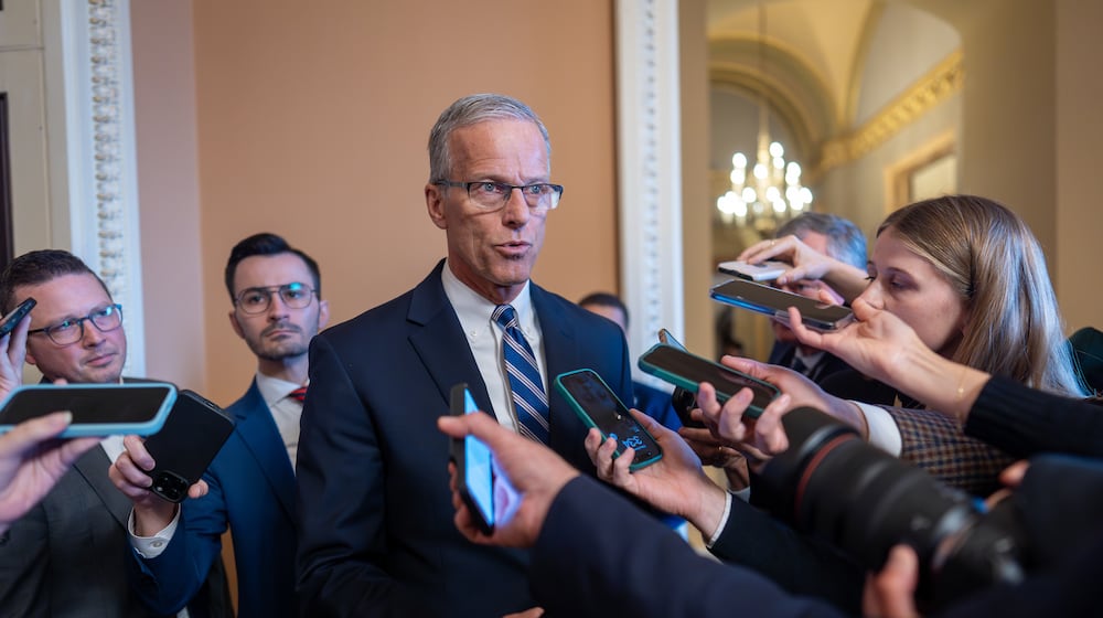 Speaking to reporters, Senate Majority Leader John Thune, R-S.D., responds to Senate Democratic Leader Chuck Schumer to reopen the government if Republicans extend expiring health care subsidies for one year, at the Capitol in Washington, Friday, Nov. 7, 2025, day 38 of the government shutdown. (AP Photo/J. Scott Applewhite)
