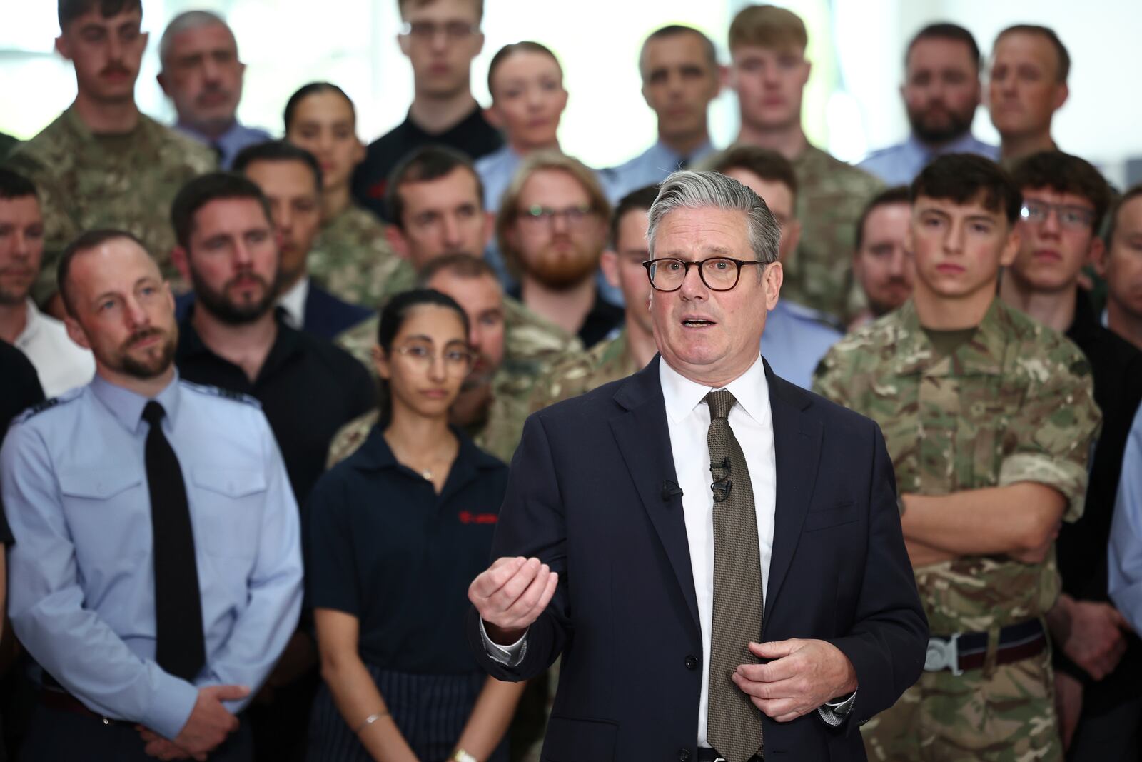 Britain's Prime Minister Keir Starmer speaks to members of staff during a visit to Leonardo, one of the biggest suppliers of defence and security equipment to the UK MOD, in Luton, England, Friday, May 2, 2025. (Henry Nicholls/Pool Photo via AP)