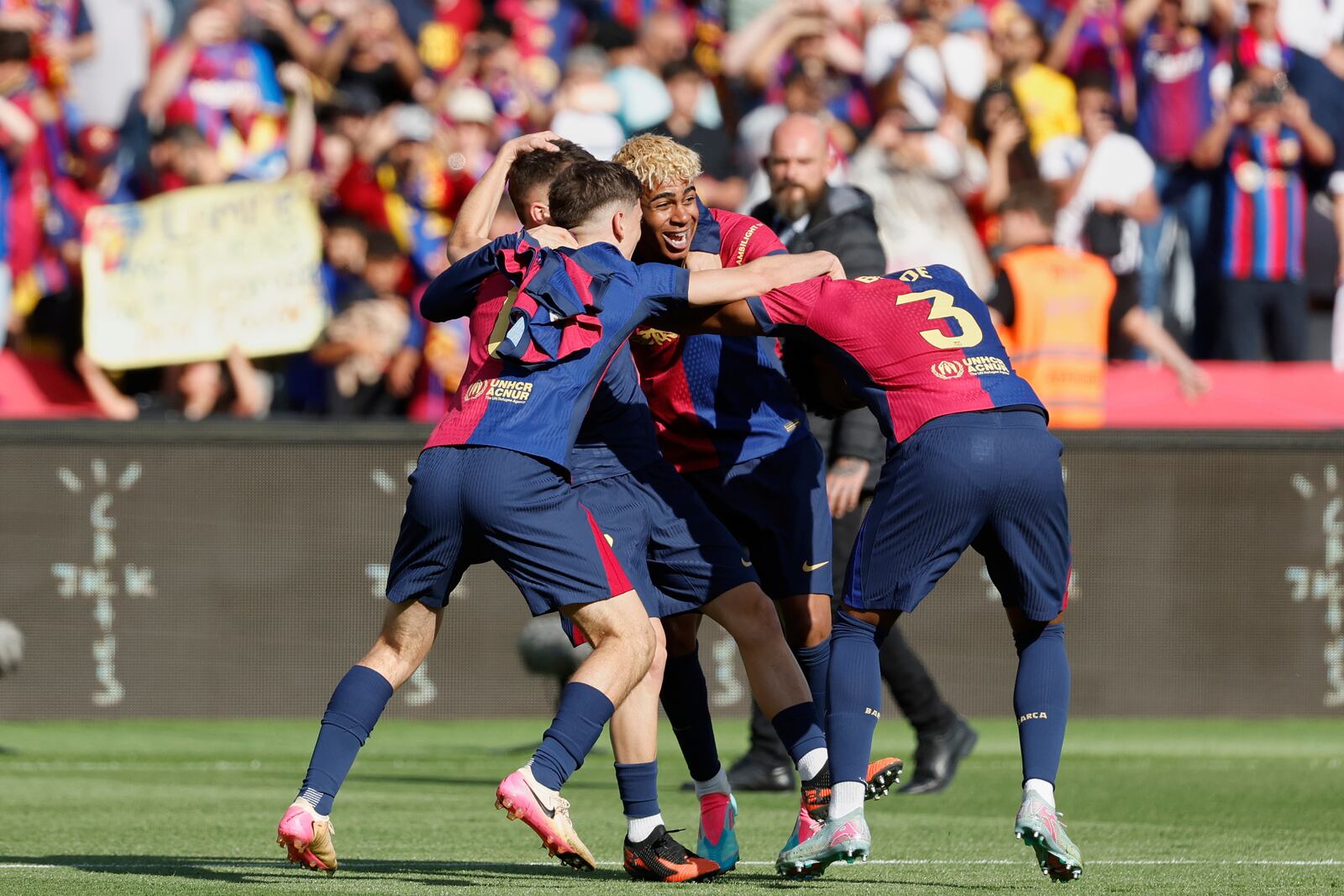 Barcelona players celebrate after the La Liga soccer match between Barcelona and Real Madrid in Barcelona, Spain, Sunday, May 11, 2025. AP Photo/Joan Monfort)