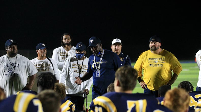 Springfield coach Maurice Douglass talks to the team after a victory against Saint Ignatius on Friday Aug. 20, 2021, at Springfield High School. David Jablonski/Staff