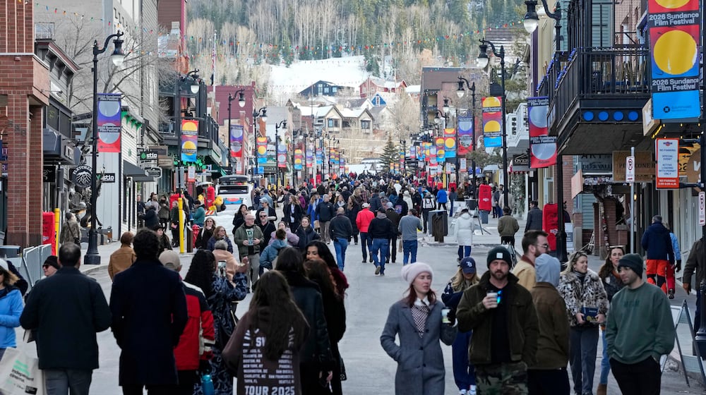 Pedestrians walk down Main Street on the first day of the 2026 Sundance Film Festival on Thursday, Jan. 22, 2026, in Park City, Utah. (Photo by Charles Sykes/Invision/AP)