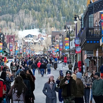 Pedestrians walk down Main Street on the first day of the 2026 Sundance Film Festival on Thursday, Jan. 22, 2026, in Park City, Utah. (Photo by Charles Sykes/Invision/AP)