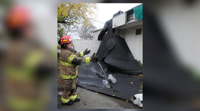 Members of the Springfield Fire Division responded to Weiler Welding on West Columbia Street after the strong winds Tuesday morning, Oct. 30, 2012, ripped the roof off the business. Northeastern Ohio saw the brunt of the storm-related losses in the state resulting from Superstorm Sandy. MARSHALL GORBY / STAFF