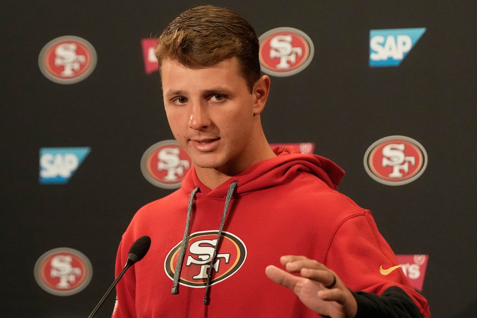 San Francisco 49ers quarterback Brock Purdy speaks during a news conference at the NFL football team's facility, Wednesday, May 21, 2025, in Santa Clara, Calif. (AP Photo/Jeff Chiu)