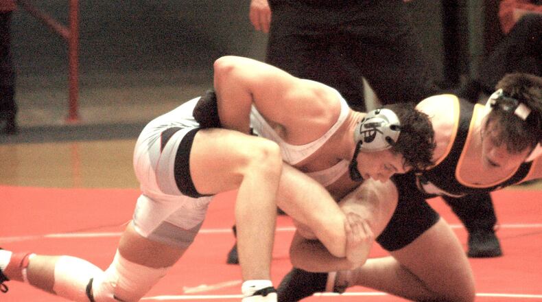 Joey Sanchez works on finishing off a takedown during his win against St. Edward in the OHSAA state team tournament finals. Graham won the D-I title 28-23 over the Eagles Sunday at St. John’s Arena. John Cummings/CONTRIBUTED