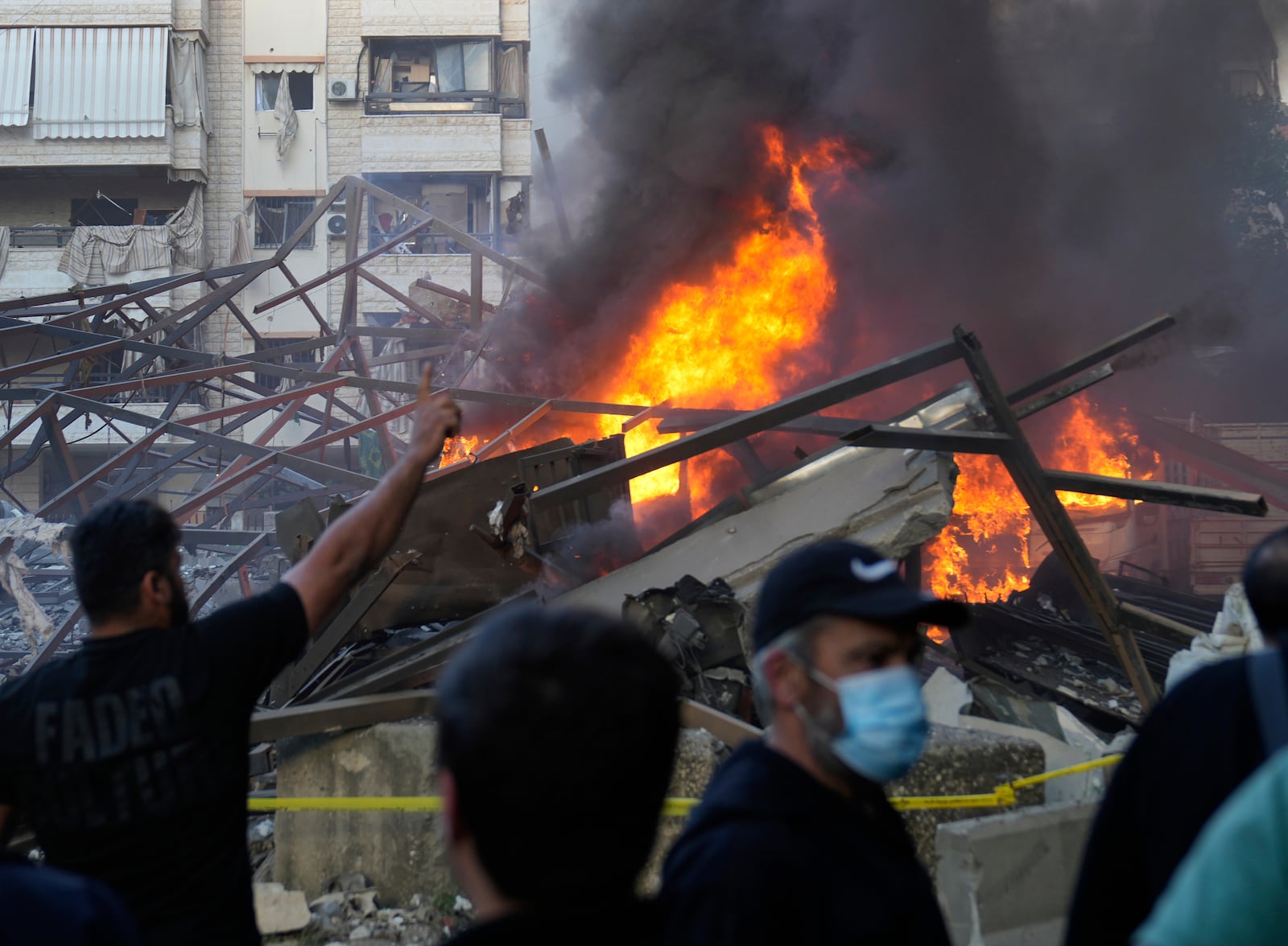 Flames rise from a metal tent that was hit by an Israeli airstrike on Dahiyeh in the southern suburb of Beirut, Lebanon, Sunday, April 27, 2025. (AP Photo/Hussein Malla)