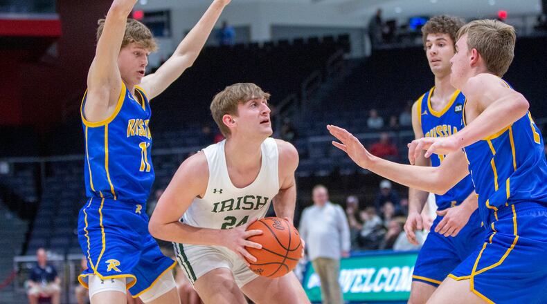 Catholic Central's Tyler Galluch looks for an opening against Russia during Tuesday night's Division IV district final at UD Arena. Galluch scored 20 points, but Russia won 70-58. CONTRIBUTED/Jeff Gilbert