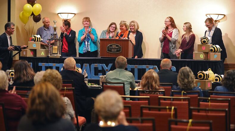 The 24th annual Literacy Sting, “Reading is Magic,” will be held starting at 11:30 a.m. on Tuesday, Sept. 26, at the Springfield Courtyard Marriot. In this file photo, three teams tied for first place in the 21st annual competition. Pictured on stage were the three winning teams from Clark State Community College, The Ohio State University Extension Master Gardeners and Gorman, Veskauf, Henson & Wineberg Attorneys. FILE/BILL LACKEY/STAFF