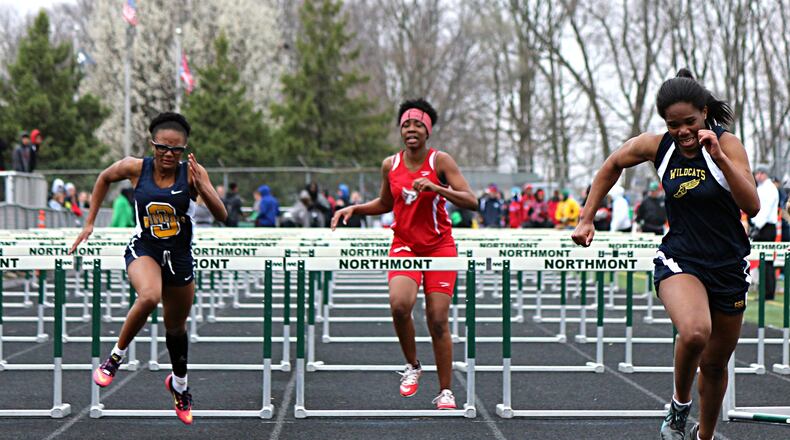Springfield’s Naomi Hookfin (right) wins the 100-meter hurdles as teammate Shardnonay Johnson (left) finishes seventh Saturday. GREG BILLING / CONTRIBUTED