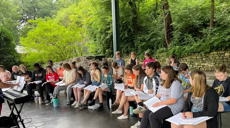 The cast of "Heathers the Musical: High School Edition" attends a rehearsal in Veterans Park. The group is undergoing an unusual approach of learning and rehearsing the show in just 24 hours over three days. It will be presented Wednesday as part of the Summer Arts Festival.