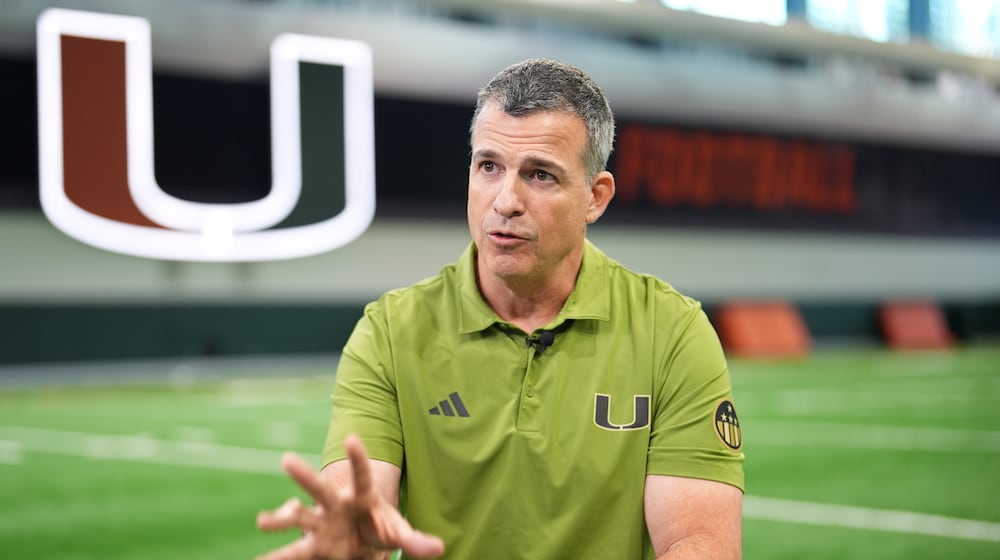 Miami football head coach Mario Cristobal speaks during an interview on the team's indoor practice field in Coral Gables, Fla., Monday, Jan. 12, 2026. (AP Photo/Rebecca Blackwell)
