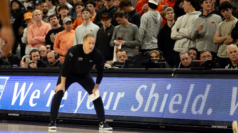 BYU head coach Kevin Young stands on the baseline in the first half of an NCAA college basketball game against Oklahoma State, Wednesday, Feb. 4, 2026 in Stillwater, Okla. (AP Photo/Mitch Alcala)