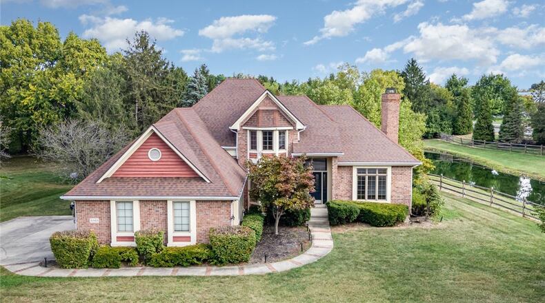 This brick two story sits on a half acre wooded corner lot next to a duck pond. It is in the Centerville City School District. CONTRIBUTED