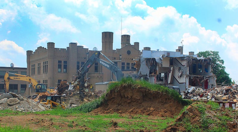 Urbana City Schools has started the demolition of the old junior high school but is keeping the iconic castle. JEFF GUERINI/STAFF