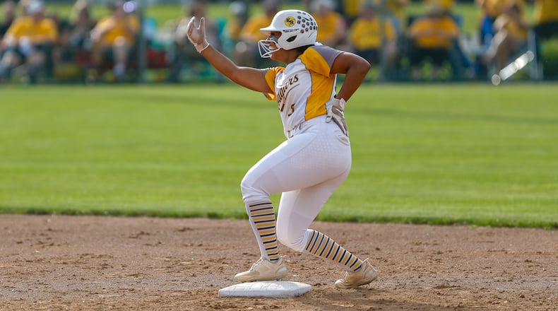Kenton Ridge's Cara Cammon celebrates at second base during the Cougars 6-2 victory over Granville in the D-II regional championship game at Wright State University last May. Michael Cooper/CONTRIBUTED