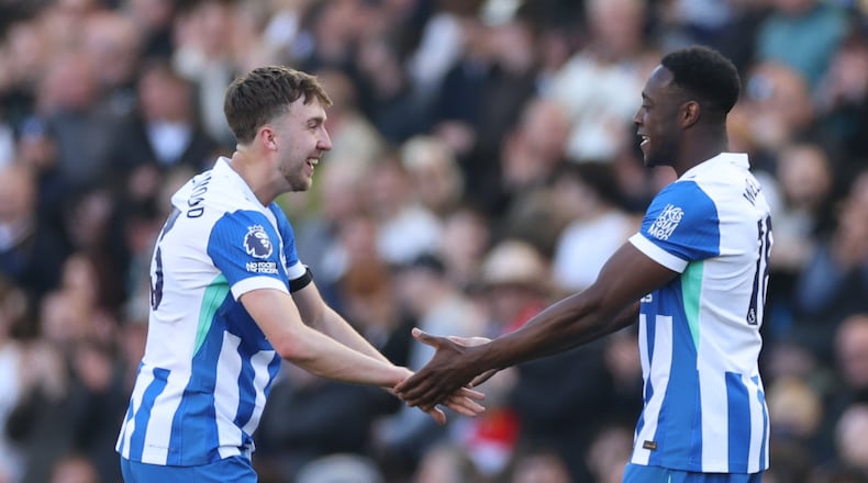 Brighton's Jack Hinshelwood, left, and Danny Welbeck celebrate after a goal during the English Premier League soccer match between Brighton and Liverpool in Brighton, Saturday, March 21, 2026. (AP Photo/Ian Walton)
