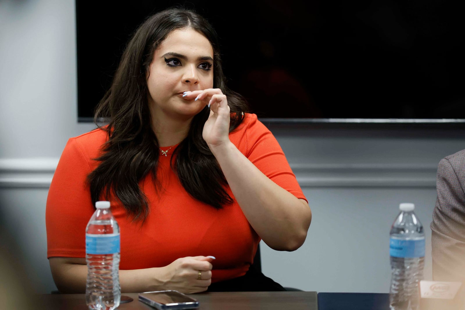 Katherine Guevara, daughter of Mario Guevara, a metro Atlanta-based Spanish-language reporter for MGNews, reacts as she speaks during a press conference with her father's attorneys, Giovanni Diaz, and Zacharias Gaeta, discussing his status following his arrest while covering an immigration rally, Tuesday, June 17, 2025, in Smyrna, Ga. (Miguel Martinez/Atlanta Journal-Constitution via AP)