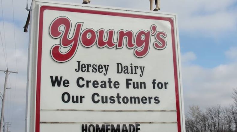 The cow statue on top of the sign for Young’s Jersey Dairy on U.S. 68 was blown off its perch during high winds Saturday April 2, 2016. (Contributed)