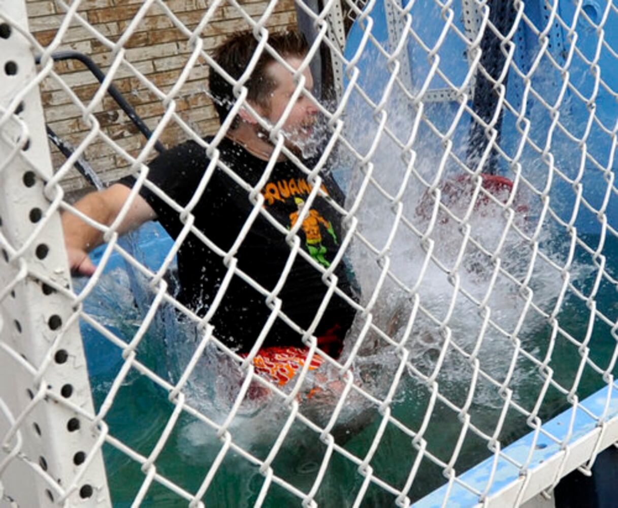 Sun columnist Andy McGinn sits in a dunking tank for charity