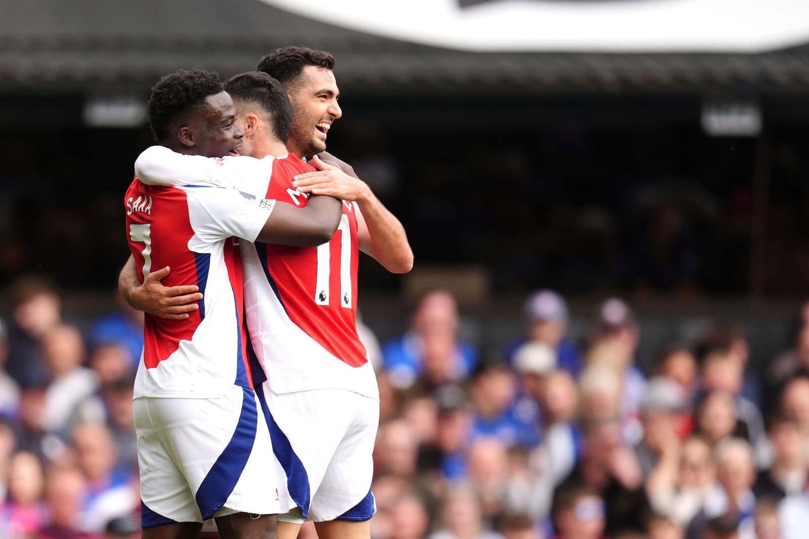 Arsenal's Gabriel Martinelli celebrates scoring his side's second goal of the game with teammates, during the English Premier League soccer match between Ipswich Town and Arsenal at Portman Road, Ipswich, England, Sunday, April 20, 2025. (John Walton/PA via AP)