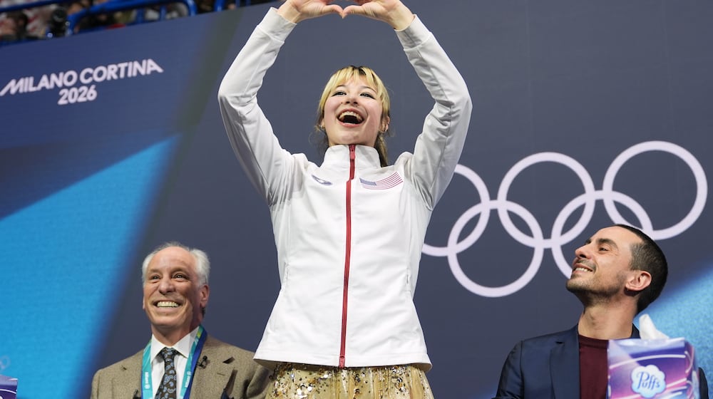 Alysa Liu of the United States reacts to her score after competing in the women's figure skating free program at the 2026 Winter Olympics, in Milan, Italy, Thursday, Feb. 19, 2026. (AP Photo/Stephanie Scarbrough)