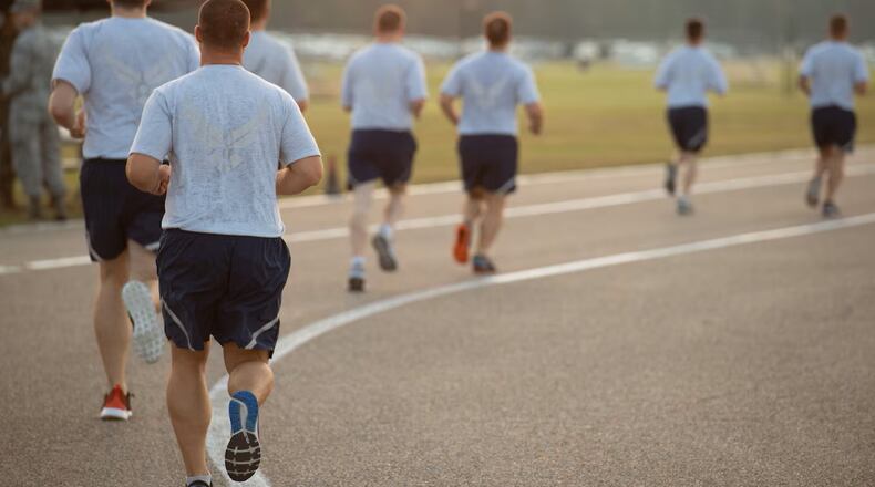 Officer Training School trainees run during an official Air Force Physical Training test, Aug. 8, 2019, at Maxwell Air Force Base, Alabama. The Air Force PT test is comprised of four components: aerobic, body composition, push-ups and sit-ups. Air Force photo by Airman 1st Class Charles Welty