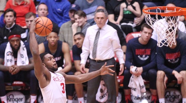 Dayton's Trey Landers dunks against Duquesne in the first half on Wednesday, Feb. 7, 2018, at UD Arena.