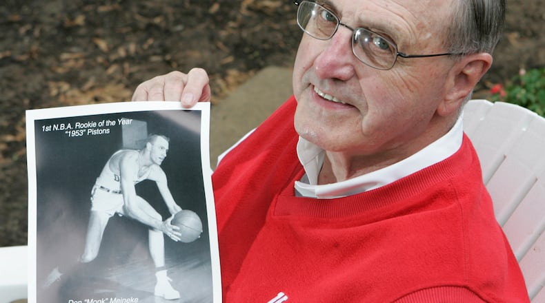 14 May 09. Don "Monk" Meineke, a former University of Dayton basketball star, shows a picture displaying that he was the first NBA Rookie of the Year, in 1953.