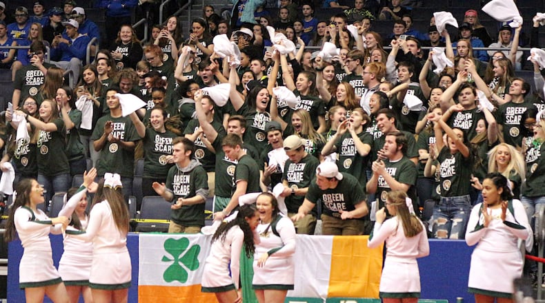 Catholic Central’s student section celebrates a Division IV district championship at the University of Dayton Arena on Friday. GREG BILLING / CONTRIBUTED