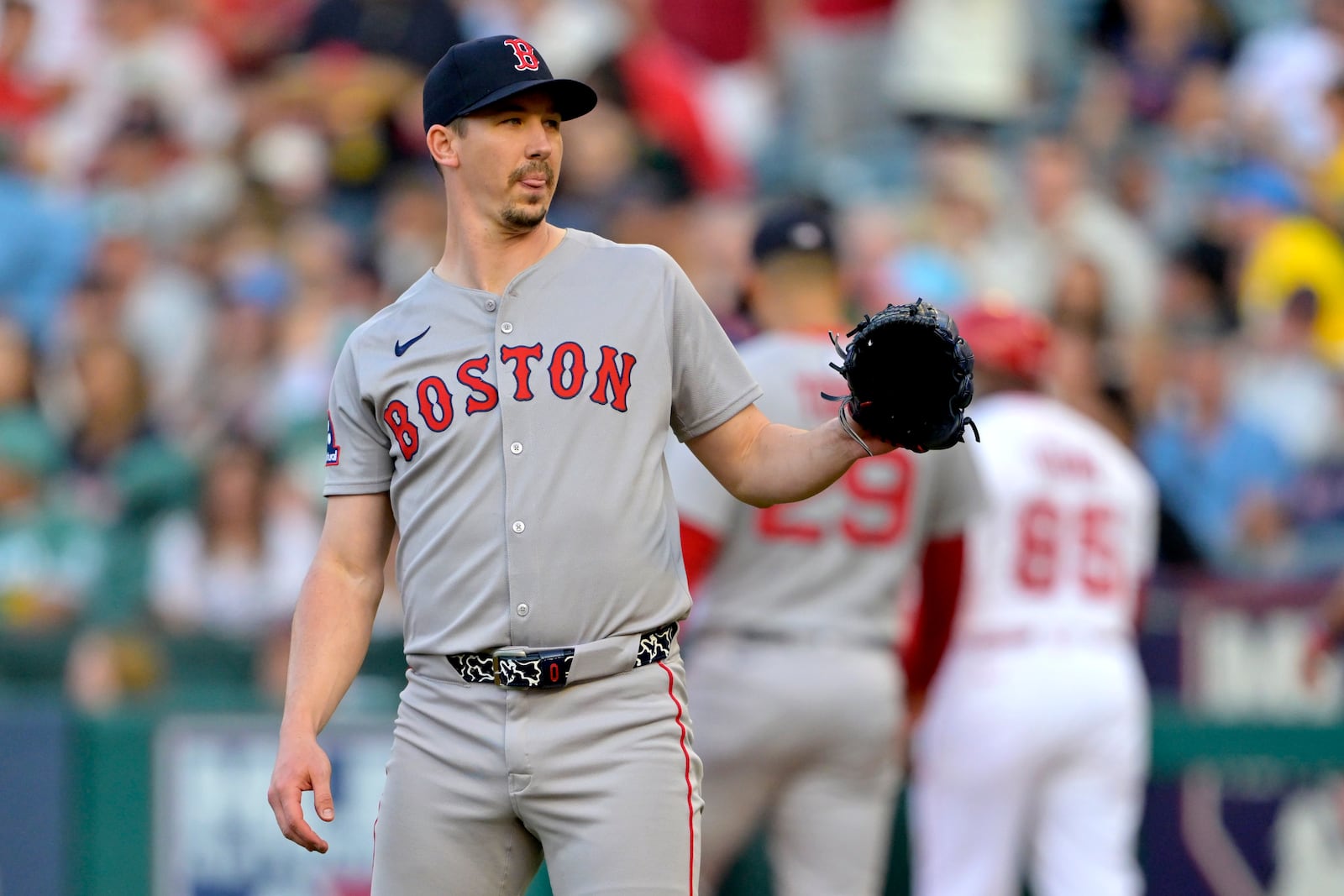 Boston Red Sox starting pitcher Walker Buehler reacts after giving up a solo home run to Los Angeles Angels' Zach Neto on the first pitch of a baseball game during the first inning, Monday, June 23, 2025, in Anaheim, Calif. (AP Photo/Jayne Kamin-Oncea)