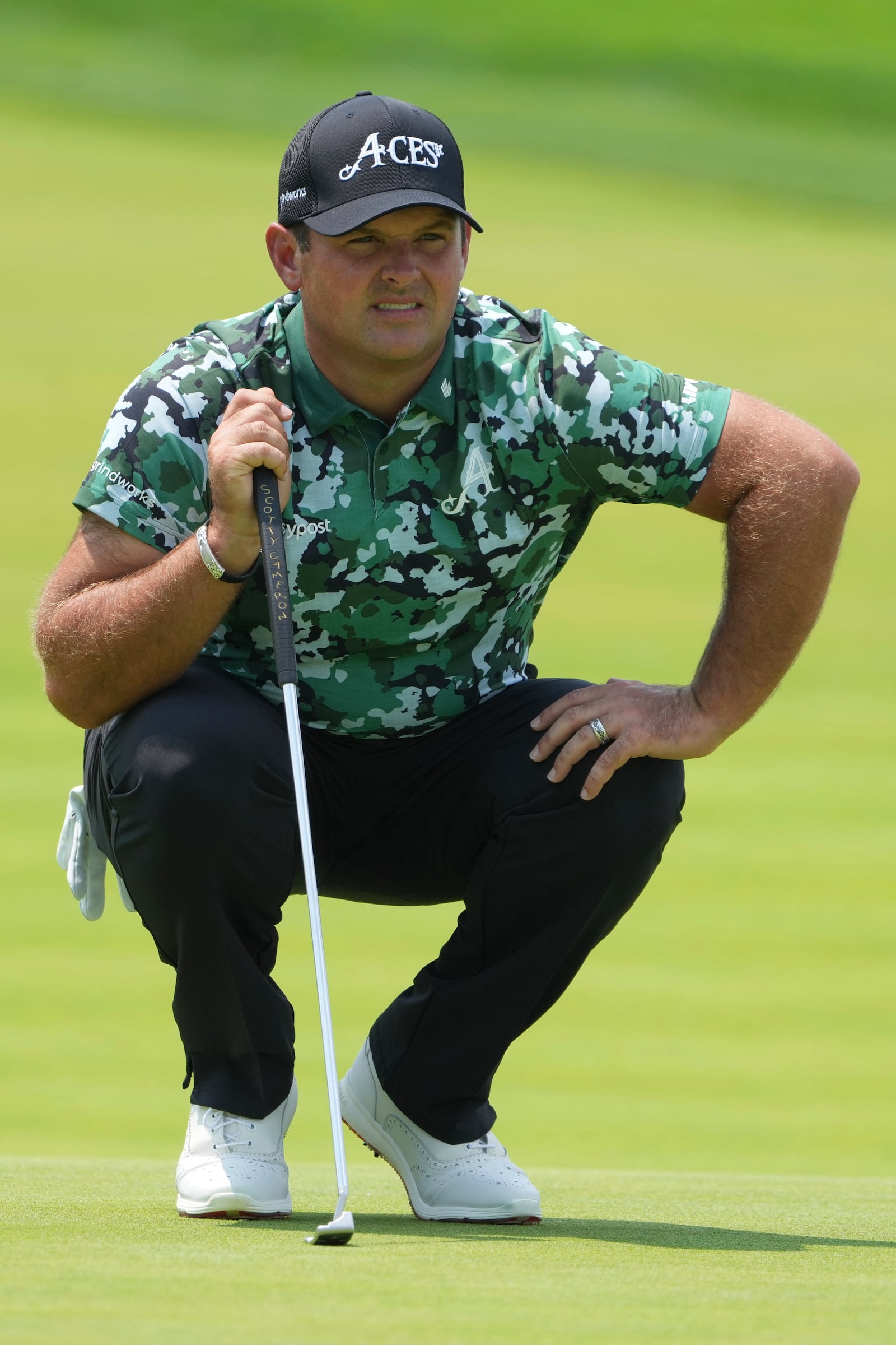 Patrick Reed lines up a putt on the first hole during the first round of the U.S. Open golf tournament at Oakmont Country Club Thursday, June 12, 2025, in Oakmont, Pa. (AP Photo/Gene J. Puskar)